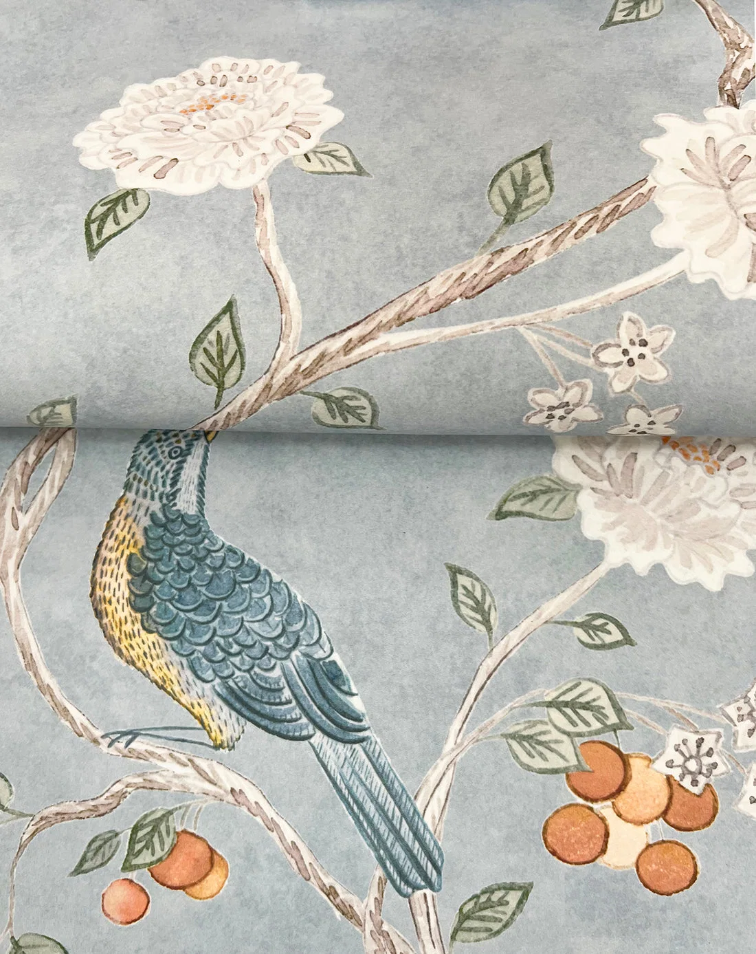 Wellesley Chinoiserie wallpaper detail with a bird, branches, and fruit